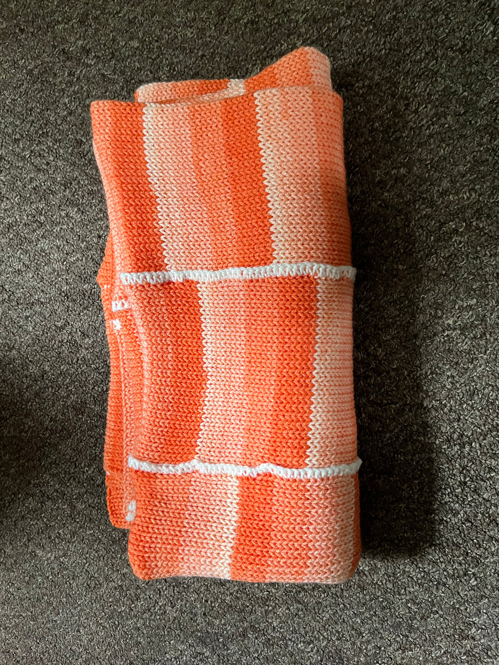 A beautiful orange striped knitted blanket 1.2M x 1.2M