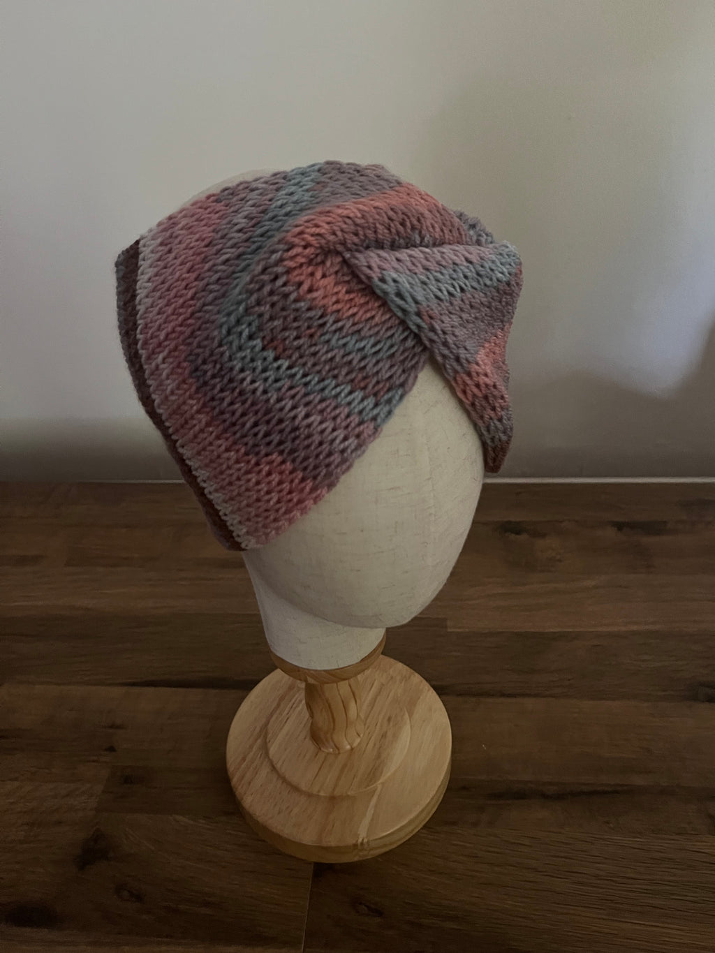 Hand made knitted ear warmer in pastel neutral colour