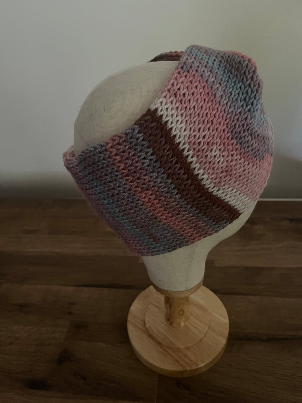 Hand made knitted ear warmer in pastel neutral colour