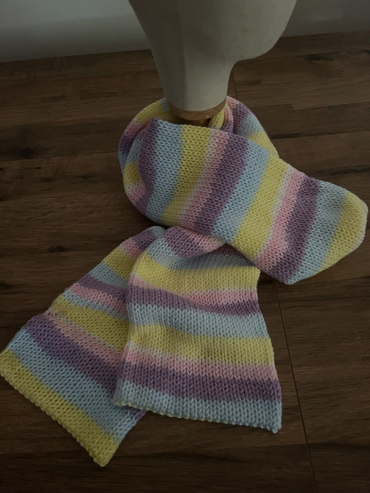 Hand made long knitted scarf in a pastel rainbow colour approx 2.4m