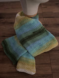 Handmade knitted scarf approx 1.4m in a variegated green,yellow and blue