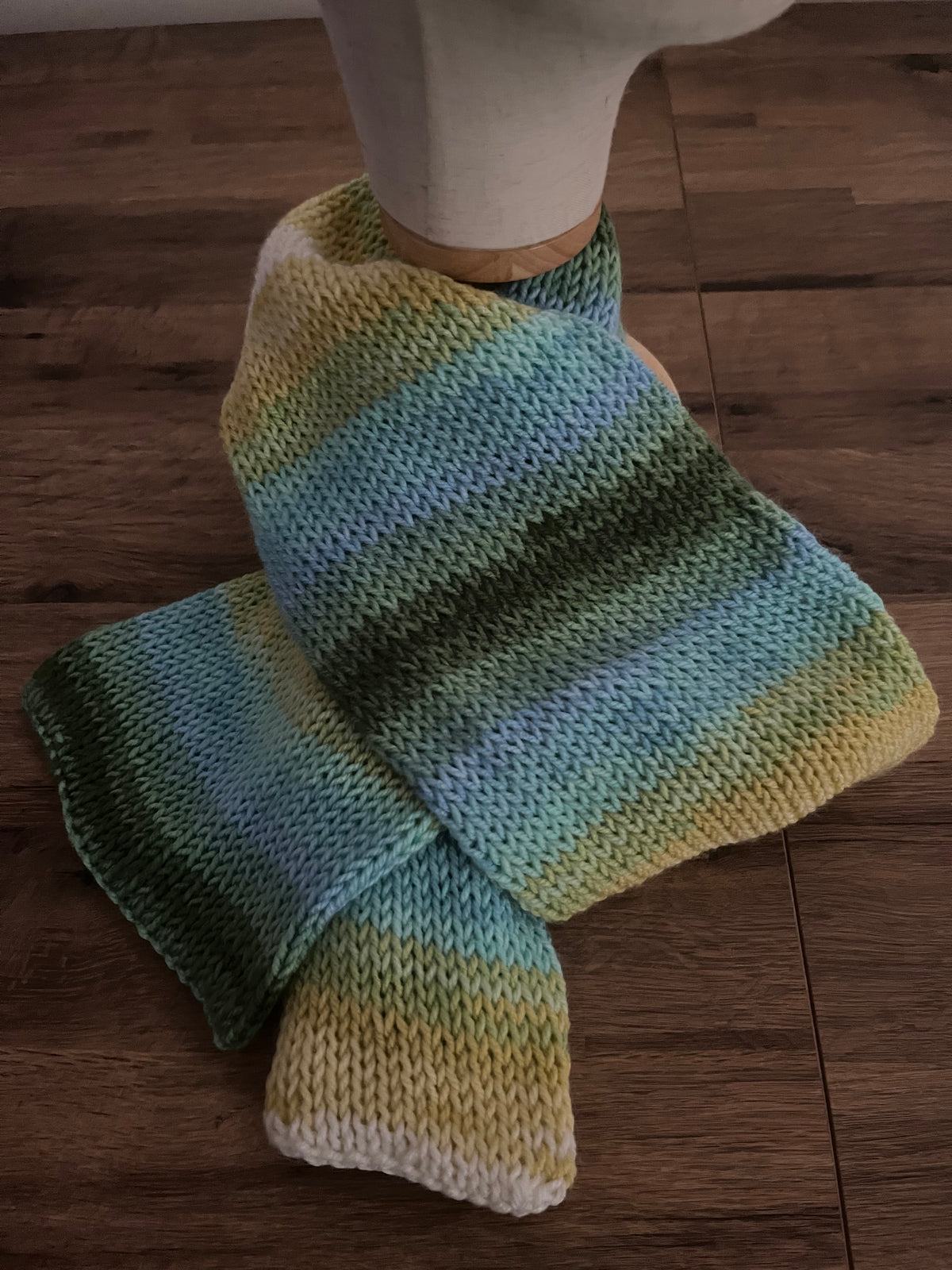 Handmade knitted scarf approx 1.4m in a variegated green,yellow and blue