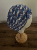 Hand made crocheted flower slouchy hat in a blue purple variegated colour